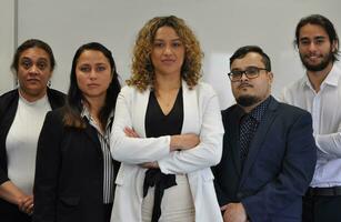 Maori, Pacific Islanders in business setting for meeting and coaching photo