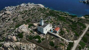 Aerial descending view of lighthouse Faro Maritimo di Capo Testa in Sardinia video