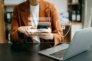Cyber security concept, Login, User, identification information security and encryption, secure access to user's personal information woman using smart phone and tablet in office photo
