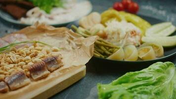 various salty appetizers, lard with bread and pickles on the table smooth motion video