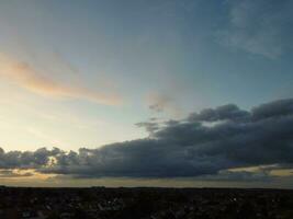High Angle view of Beautiful Clouds and Sky over Luton City During Sunset photo