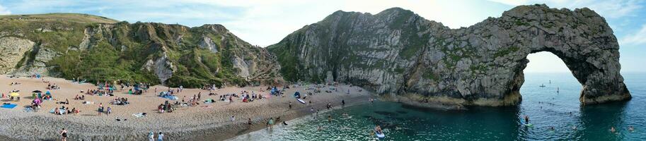 Most Beautiful High Angle View of British Landscape and Sea View of Durdle Door Beach of England Great Britain, UK. Image Was captured with Drone's camera on September 9th, 2023 photo