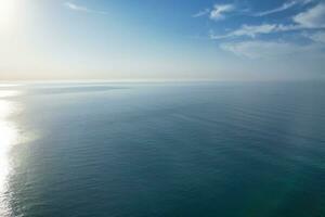 Most Beautiful View of British Landscape and Sea View of Durdle Door Beach of England Great Britain, UK. Image Was captured with Drone's camera on September 9th, 2023 photo