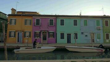 Burano island view with street along the canal, Italy video