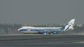 Winter view of freighter Boeing 747 taxiing video