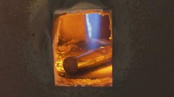 Blacksmith heating a hot metal rod, 4k footage video