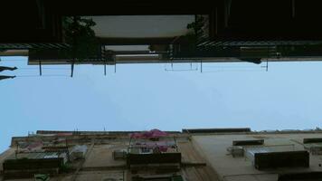 Sky and houses with linen outside, bottom view. Naples, Italy video