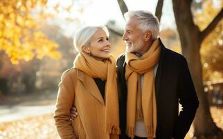 Old couple walking outside in autumn photo