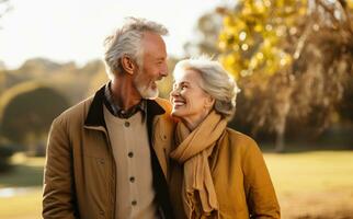 Old couple walking outside in autumn photo