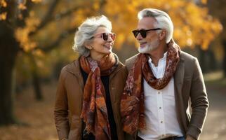 Old couple walking outside in autumn photo