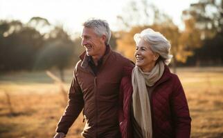 Old couple walking outside in autumn photo