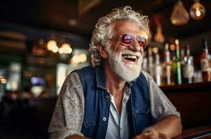 An old man is laughing in a pub photo