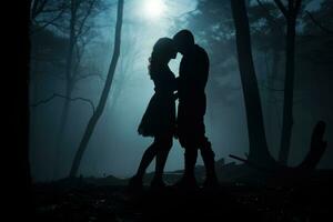 Woman and man kissing in the forest photo