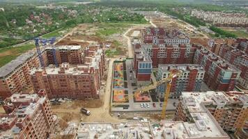 An aerial view of a construction site of residential buildings in front of the countryside scenery video