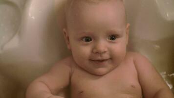 Happy baby girl bathing video