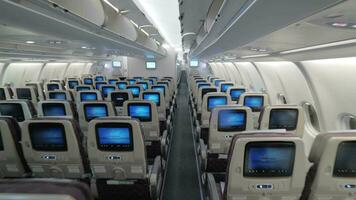 Jet airplane interior view economy class monitors on seats video