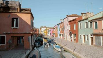 Brightly coloured houses alongside the canal in Burano, Italy video