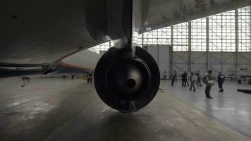 Airplane in repair hangar video