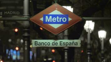 Night view of Banco de Espana metro sign in Madrid, Spain video