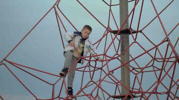 A boy on a red climbing web video