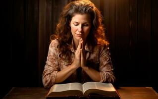 Middle aged woman praying with her hands on the Bible. AI Generative photo