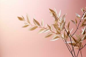 A close-up shot of delicate mistletoe leaves on a light blush pink background creating a subtle yet festive ambiance photo