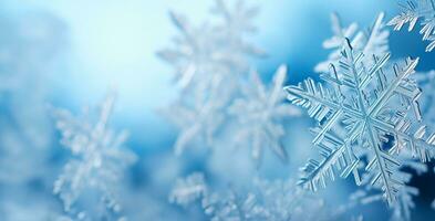 Close-up of delicate snowflakes in low relief against a serene icy blue background providing ample space for captivating winter photo