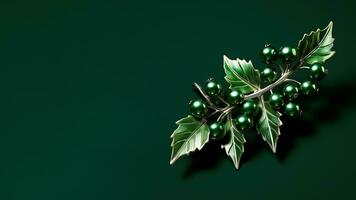 Verdant holly berry sprig with antique mercury glass beads elegantly placed isolated on a emerald green gradient background photo