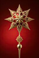 Victorian style Christmas tree topper a golden star gleaming with sparkle isolated on a holiday red gradient background photo