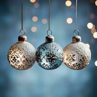 Antique glass ball ornaments kissed with frost hanging isolated on a dusky blue to icy white gradient background photo