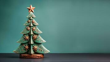 Hand-carved wooden Christmas tree adorned with vintage tin star isolated on a pine green to sky blue gradient background photo