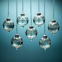 Antique glass ball ornaments kissed with frost hanging isolated on a dusky blue to icy white gradient background photo