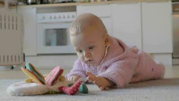 Adorable baby girl playing at home on the carpet video