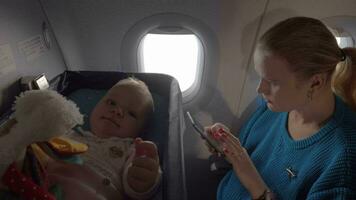 Baby in a cot on an airplane video