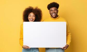 Black couple smiling and showing white board photo