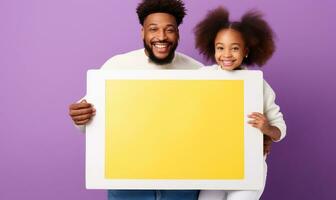 Black couple smiling and showing white board photo