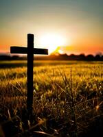 silhouette of a cross in a field photo