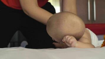 Baby girl learning how to roll over video