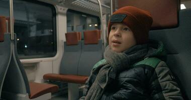 Boy riding on a commuter train video