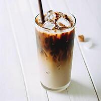 Iced coffee with coconut milk in a tall glass on white wooden table. AI Generative photo