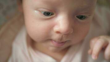 Newborn baby girl making faces video