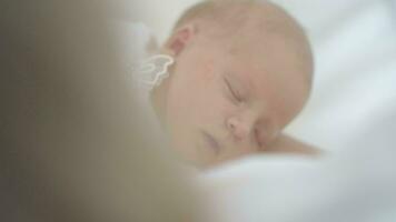 Newborn baby girl asleep while in her crib video