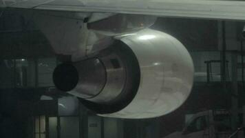 Turbine of parked airplane, view at winter night video