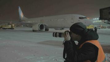 Photographer working in the airport at night video