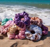 Photoshoot of colourful hair bands on a beach photo
