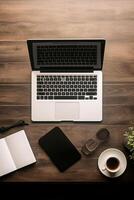 Neatly arranged workspace with a modern laptop and stationary, offering abundant copy space photo