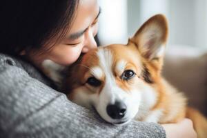 portrait of woman hugging cute corgi dog. pet concept photo