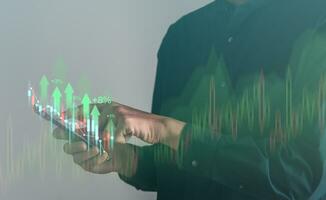 Business using mobile phont with exponential arrow and financial graph for business investment growth. Financial, data analysis, goal,success and money concept. photo