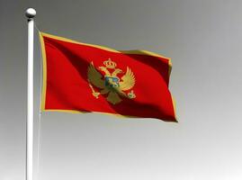 Montenegro national flag waving on gray background photo