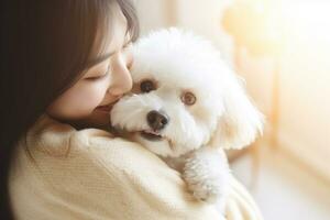 portrait of woman hugging cute bichon frise dog. pet concept photo